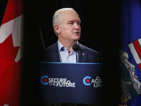 Conservative Leader Erin O'Toole reads from a teleprompter as he makes an announcement in Calgary on Thursday, July 8, 2021.