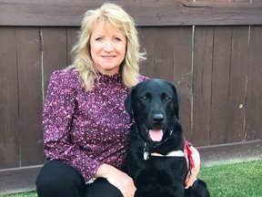Airdrie-based trauma dog handler Deb Reid and Jake, the facility support dog, have won this year's Alberta Community Justice Award.