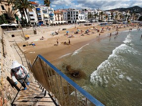 People cool off at a beach in Sitges town, south of Barcelona, Spain, July 15, 2021. REUTERS/Albert Gea ORG XMIT: GGG-BAR107