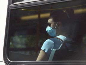 A passenger on a Calgary Transit bus wears a mask on Friday, June 25, 2021.