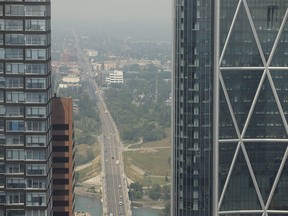 Smoke from wildfires in B.C. and the U.S. obscures Calgary on Thursday, July 15, 2021.