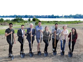 South Shores breaks ground with, from left, Soban Taj of Pyramid Homes; Adam Oruclar of GDS Developments; Chestermere Mayor Marshall Chalmers; Ryan Scott of Avalon Builders; Lindsay McGregor of Crystal Creek Homes; Pal Shergil of Prominent Homes; Brenda Gould of Maddison Avenue Group; and Imaan Amlani of Edgewater Communities.