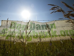 A sign opposing the construction of the Springbank dam and reservoir hangs on a fence near the intersection of Highway 22 and Springbank Road on Aug. 11, 2017.