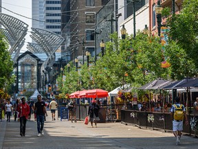 Restaurant patios do a brisk business on Stephen Avenue in Calgary on Friday, July 23, 2021.