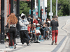 People line up outside a COVID-19 vaccination walk-in clinic in Winnipeg, June 22, 2021.