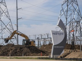 A backhoe digs at the Inter Pipeline Heartland Petrochemical Complex under construction in Strathcona County, Alberta.
