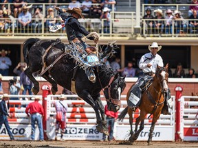 Zeke Thurston from Big Valley, Alta., competes in the Saddle Bronc event on Day 3 of the Calgary Stampede on July 11, 2021.