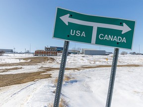 File photo: Road that runs along the international border between Montana and Alberta. Sweetgrass, Montana, USA on the left and Coutts, Alberta, Canada on Friday March 20, 2020.