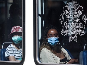 Face masks remain mandatory in publicly accessible transit, taxis and ride-shares in Alberta on Friday, August 13, 2021. Passengers on a CTrain in downtown Calgary wear masks.