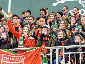 Cavalry FC fans wear masks of general manager/head coach Tommy Wheeldon Jr. during the second game of Canadian Premier League final against  Forge FC at ATCO Field at Spruce Meadows on Nov. 2, 2019.