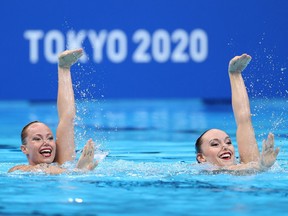 Canada’s Claudia Holzner and Jacqueline Simoneau ompete in the artistic swimming duet preliminary round during the 2020 Olympic Games at Tokyo Aquatics Centre on Monday, Aug. 2, 2021.
