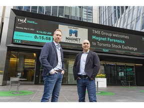From left, Adam Belsher, chief executive officer, and Jad Saliba, founder and chief technology officer of Magnet Forensics, celebrate at the Toronto Stock Exchange on May 3, 2021, when their company virtually opened the market after their initial public offering.