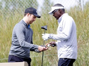 Pro golfer Vijay Singh with his Caddie, Carter Milton, a Canyon Meadows staffer, practices during the SHAW Charity Golf Classic at the Canyon Meadows Golf and Country Club in Calgary on Tuesday, August 10, 2021. Darren Makowichuk/Postmedia