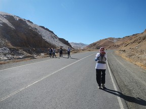 Canada's Marathon Man, Martin Parnell, from Cochrane, Alberta, and an Afghan woman took part in a 42-kilometre marathon in Afghanistan. The race was kept super-secret because in a previous year locals tried to stone a women running in it.