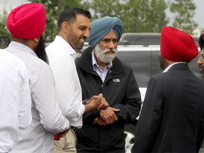 George Chahal, Liberal candidate for Calgary Skyview, greets supporters at his official campaign launch event outside Rio Banquet Hall. Sunday, Aug. 8, 2021.