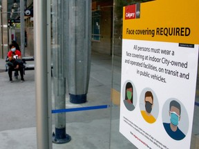 A sign reminding city transit users to wear a mask is seen on a CTrain platform in downtown Calgary on Tuesday, Aug. 3, 2021.
