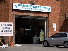 Cars are directed into the drive-thru COVID-19 testing centre at the Richmond Road Diagnostic and Treatment centre in Calgary on Tuesday, August 24, 2021.