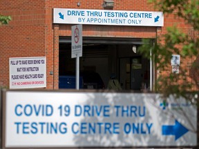 Cars are directed into the drive thru COVID-19 testing centre at the Richmond Road Diagnostic and Treatment centre in Calgary on Tuesday, August 24, 2021.