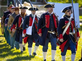 The 18th Centrury Re-enactment Group marches at the Military Museum's Summer Skirmish event on Saturday, August 28, 2021.