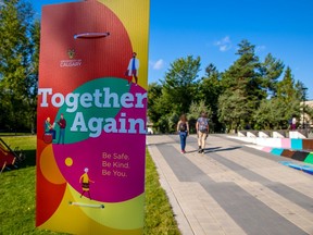 Students walk past welcome back signage on the University of Calgary campus on Tuesday, August 31, 2021.