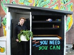 Owen Motley, volunteer, poses at the Calgary Community Fridge in Crescent Heights. The food stand which includes a fridge and freezer provides a fresh, healthy and free meal to those in need 24/7. The Calgary Community Fridge is celebrating one year of serving needy Calgarians. Sunday, August 22, 2021.