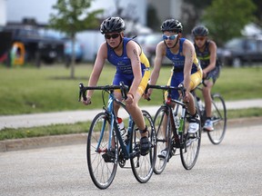 Cyclists compete in the triathlon at the 2018 Alberta Summer Games on July 21, 2018, in Grande Prairie.