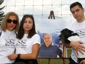 Family members Xochitl Alvarez, Celic and Uriel Perez attend a memorial for Jose Perez outside the McKenzie Meadows Golf Club on Saturday.