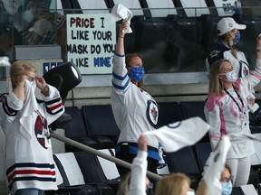 Winnipeg Jets fans cheer their team during Game 1 of the North Division final in Winnipeg on June 2, 2021.