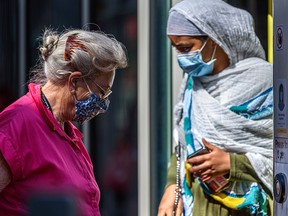 Passengers board a CTrain in downtown Calgary on Friday, Aug. 13, 2021. Face masks are still mandatory on public transit, taxis and ride-shares in Alberta.