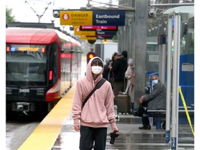 Masked transit riders are seen on an LRT platform downtown. Thursday, August 19, 2021.