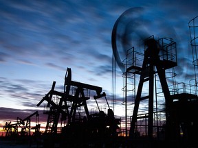 Oil pumpjacks operate in an oilfield in the Republic of Bashkortostan, Russia, on Nov. 19, 2020.