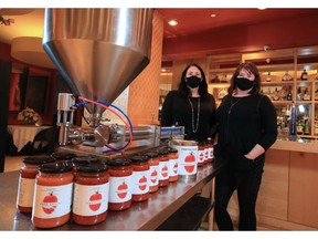 Centini Restaurant and Lounge director and proprietor Chevonne Miller-Centini, at left, and Marie-Bernard Poulin with the pasta sauces being sold under the Centini Foods brand.