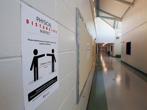 COVID-19 prevention signs are seen inside St. Marguerite School in New Brighton on Aug. 25, 2020.