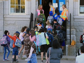 Students at Stanley Jones School head into classes on Tuesday, Sept. 1, 2020.