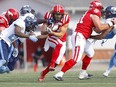 The Calgary Stampeders’ Ante Milanovic-Litre runs the ball against the Toronto Argonauts at McMahon Stadium in Calgary on Saturday, Aug. 7, 2021.