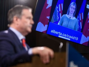 Premier Jason Kenney announces the province's new COVID restrictions at McDougall Centre in Calgary as Dr. Deena Hinshaw joins the press conference from Edmonton on Friday, September 3, 2021. Azin Ghaffari/Postmedia
