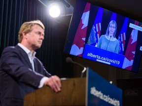 Health Minister Tyler Shandro announces the province's new COVID restrictions at McDougall Centre as Dr. Deena Hinshaw joins the press conference from Edmonton on Friday, September 3, 2021. Azin Ghaffari/Postmedia