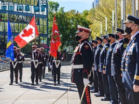 The Calgary Fire Department honours the memory of fallen firefighters and those who lost their lives to work-related illnesses at a memorial ceremony at Police Officers and Firefighters Tribute Plaza outside Calgary Municipal Building on Tuesday, September 14, 2021.