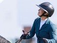 Israel's Ashlee Bond dances in celebration of riding Donatello 141 to the first place in the jump-off round of the Pepsi Challenge in the International Ring at Spruce Meadows on Thursday, September 16, 2021. Azin Ghaffari/Postmedia