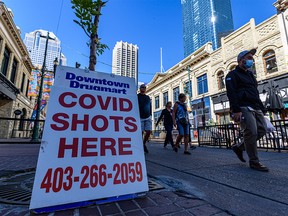 A pharmacy sign for COVID-19 vaccine availability is seen on Stephen Avenue in downtown Calgary on Tuesday, September 21, 2021.