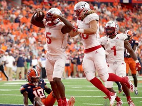 SYRACUSE, NEW YORK - SEPTEMBER 11: Jovani Haskins #5 of the Rutgers Scarlet Knights celebrates after scoring a touchdown during the third quarter against the Syracuse Orange at the Carrier Dome on September 11, 2021 in Syracuse, New York.
