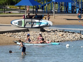 People are seen enjoying a hot afternoon at Mahogany Lake on Monday, June 28, 2021.