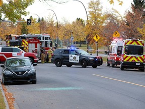 The Calgary Fire Department and Calgary police deal with a fire that sent one person to hospital from a home in the 6000 block of Penbrooke Drive S.E. on Wednesday morning, September 22, 2021.