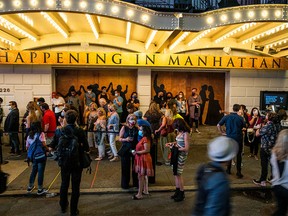 Audience members wait outside the Richard Rodgers theater ahead of the first return performance of Hamilton as Broadway shows begin to reopen to live audiences after being closed for more than a year due to the outbreak of the coronavirus disease (COVID-19) in Manhattan in New York City, New York, U.S., September 14, 2021.