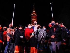 Prime Minister Justin Trudeau poses for a group photo with residential school survivors and family members, on the eve of Canada's first National Day for Truth and Reconciliation, on Parliament Hill in Ottawa, September 29, 2021. REUTERS/Blair Gable