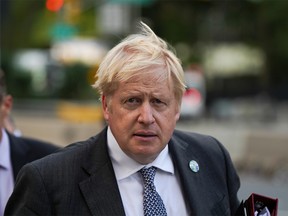 British Prime Minister Boris Johnson walks outside United Nations headquarters during the 76th Session of the U.N. General Assembly, in New York, U.S., September 20, 2021.