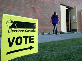 Calgary voters are seen outside a polling station at St. Helena School in the NW. Monday, September 20, 2021.