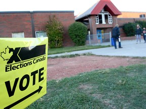 Calgary voters are seen outside a polling station at St. Helena School in the NW.  Monday, September 20, 2021.