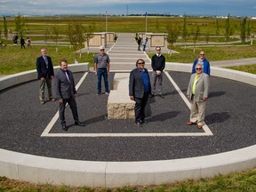 Dignitaries including Calgary Mayor Naheed Nenshi and Councillor Shane Keating pose for a photo in the central precinct area at the official opening of the City's Prairie Sky Cemetery in southeast Calgary on Wednesday, Sept. 1, 2021. Prairie Sky is the first new City cemetery to open since Queens Park in 1940, over 80 years ago.