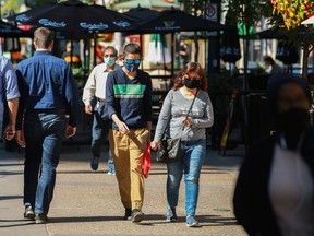 Pedestrians walk along Stephen Avenue Mall over the lunch hour in Calgary on Tuesday, September 7, 2021.